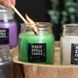 Green luck candle in a glass jar (green tea scent)