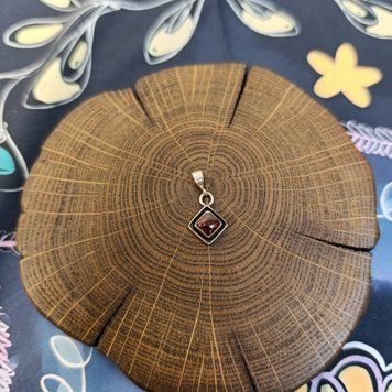 Silver amulet with Garnet